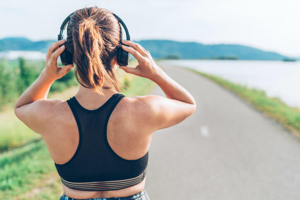 woman from behin with wireless headphones